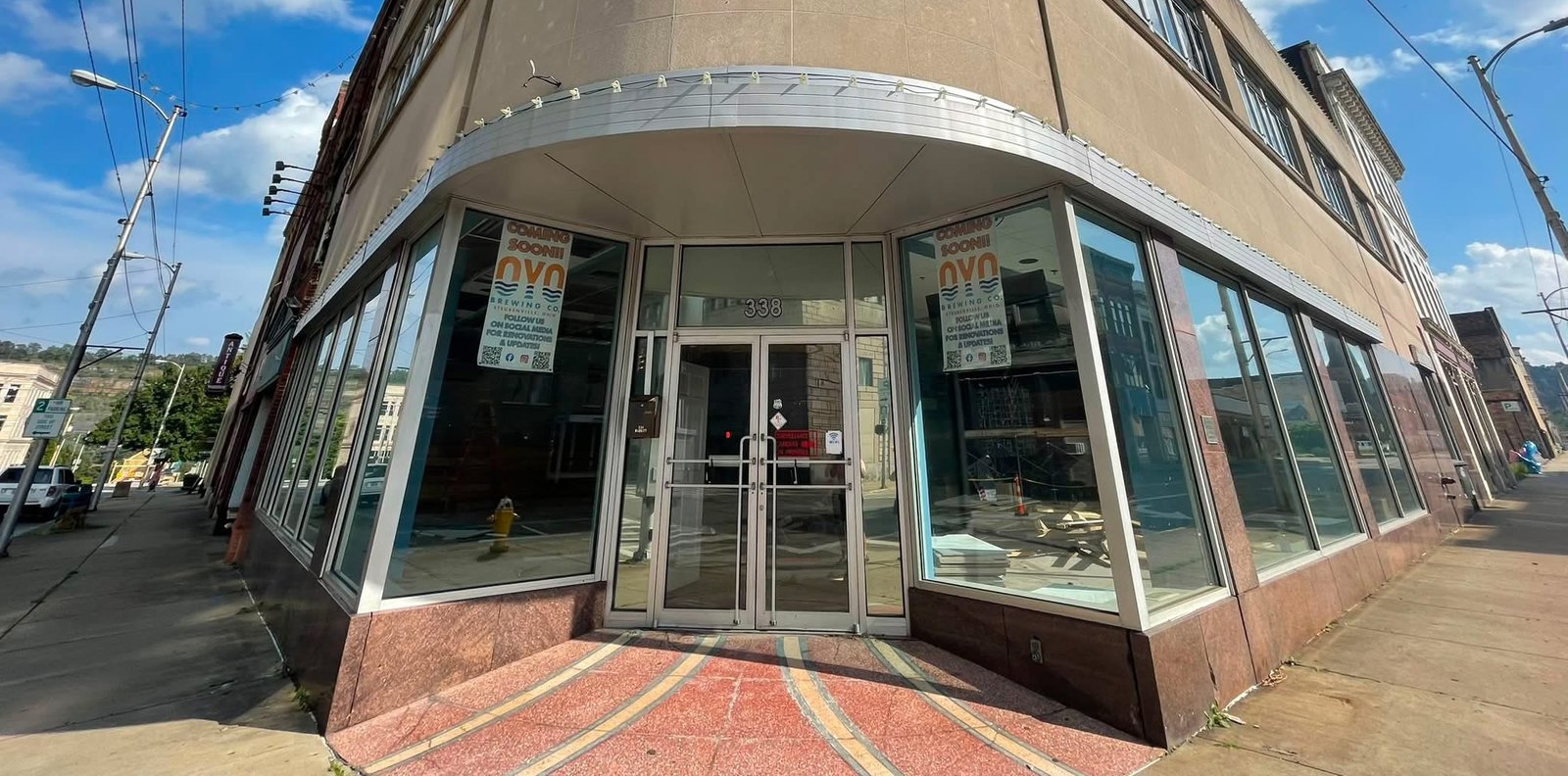 Street-level entrance of the future Oyo Brewing Co. taproom at 338 Market Street, with Coming Soon signage in the windows